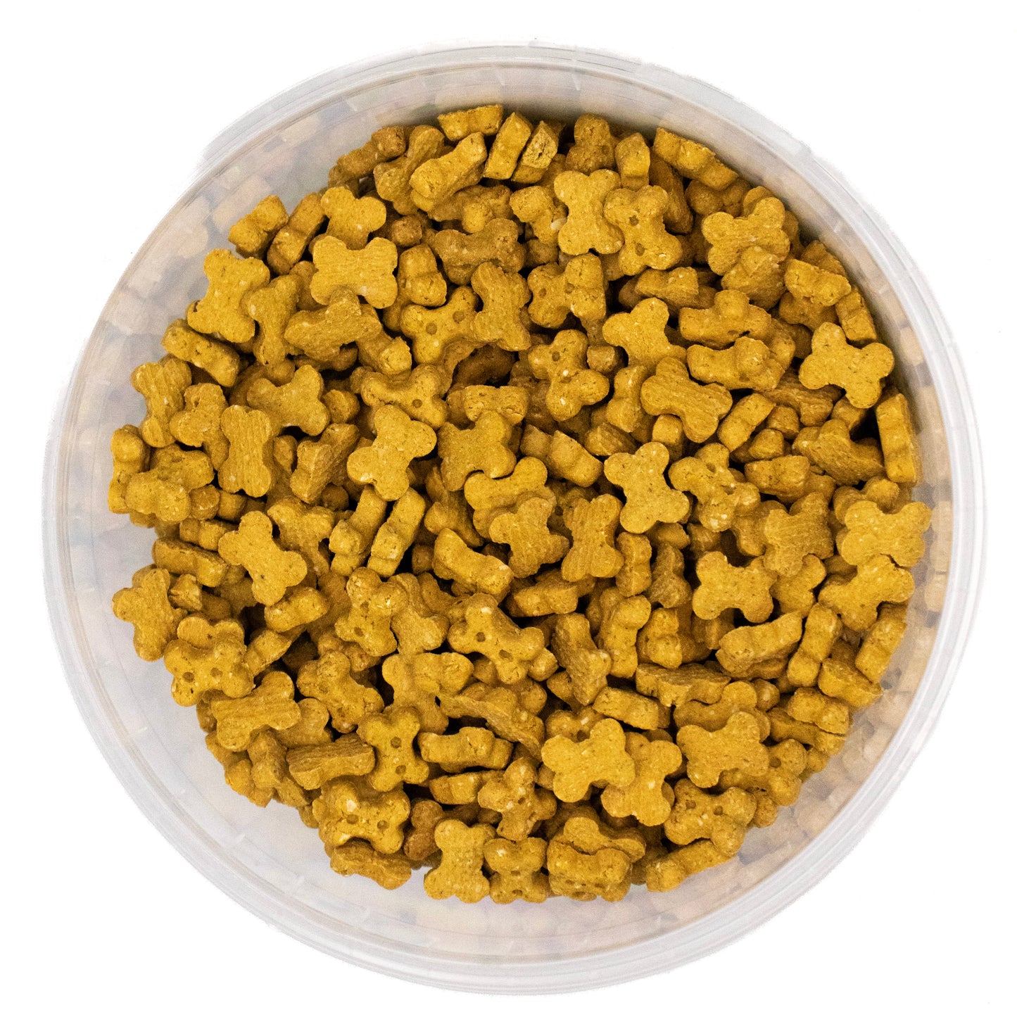 A top-down view of small, bone-shaped golden-brown kibble or pet food pieces filling a clear plastic round container against a white background.