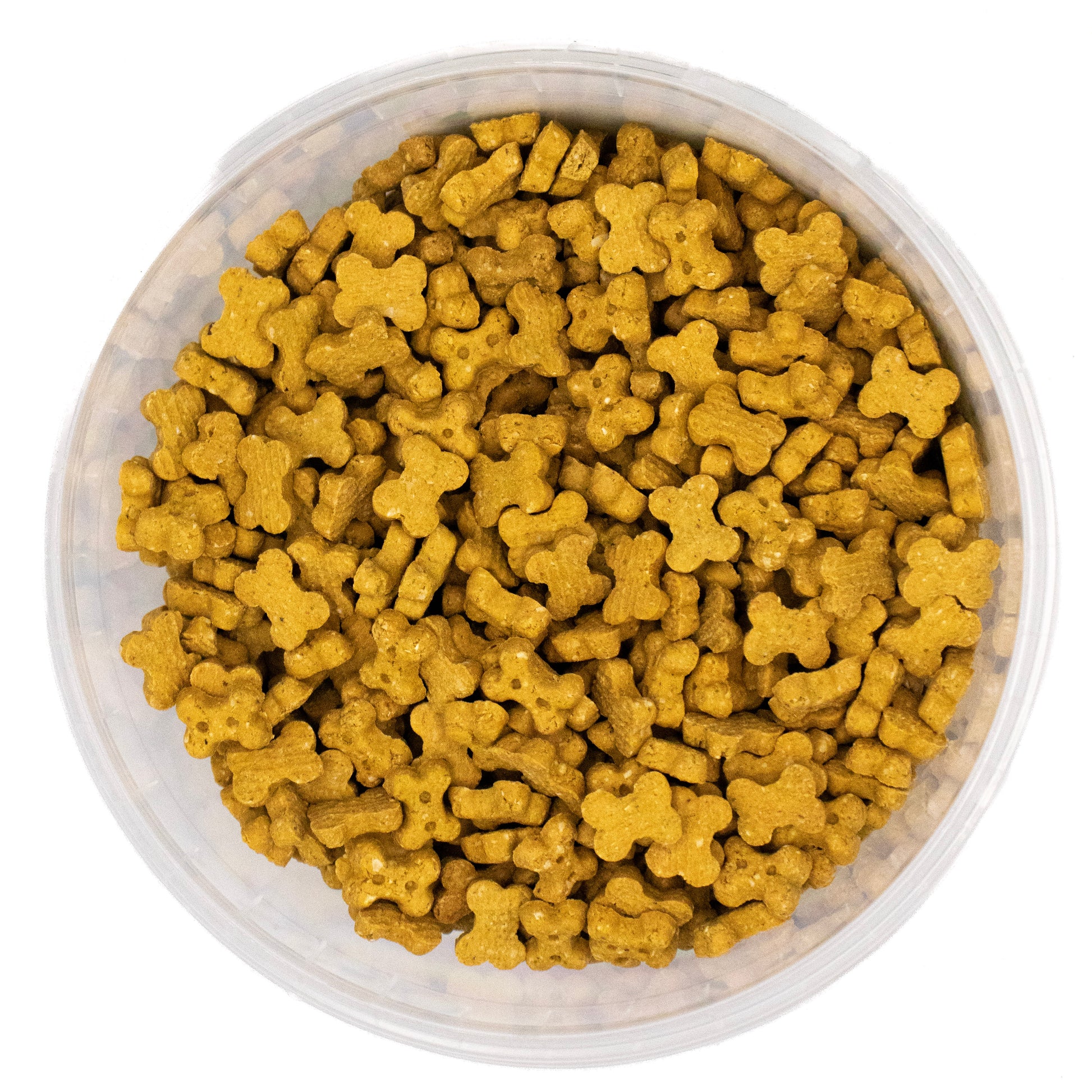 A top-down view of small, bone-shaped golden-brown kibble or pet food pieces filling a clear plastic round container against a white background.